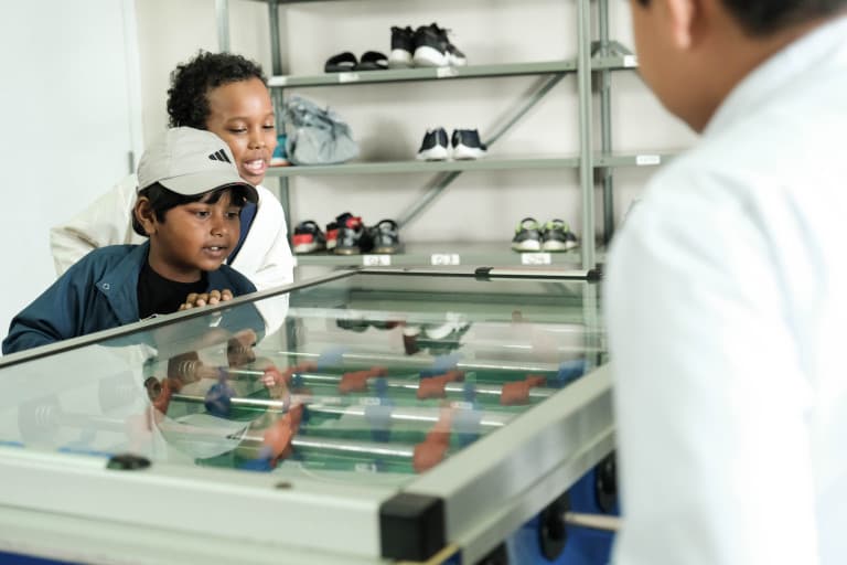 Children playing table football during a break