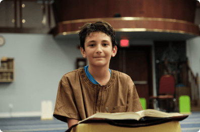 Student with an open Quran